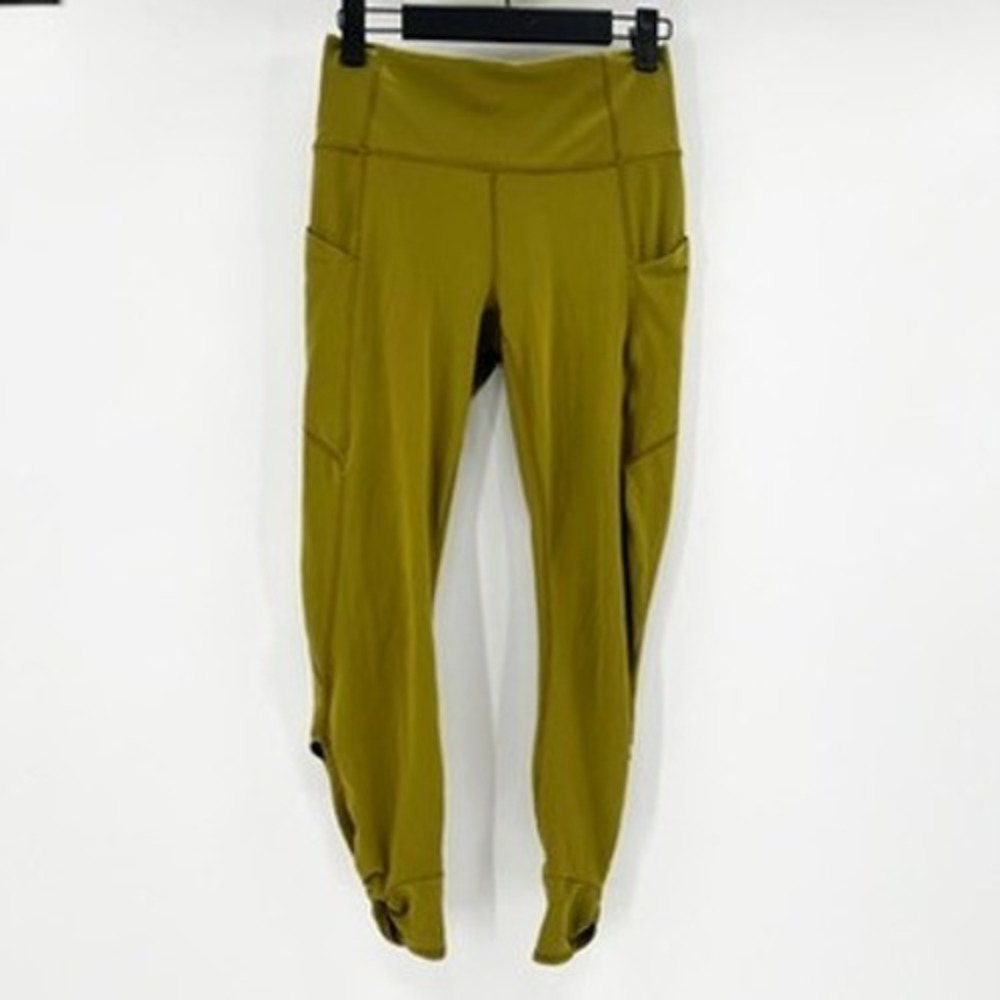 Fabletics PureLuxe High Waisted Pocket Leggings Olive Green Tulip Hem Ankle Wrap